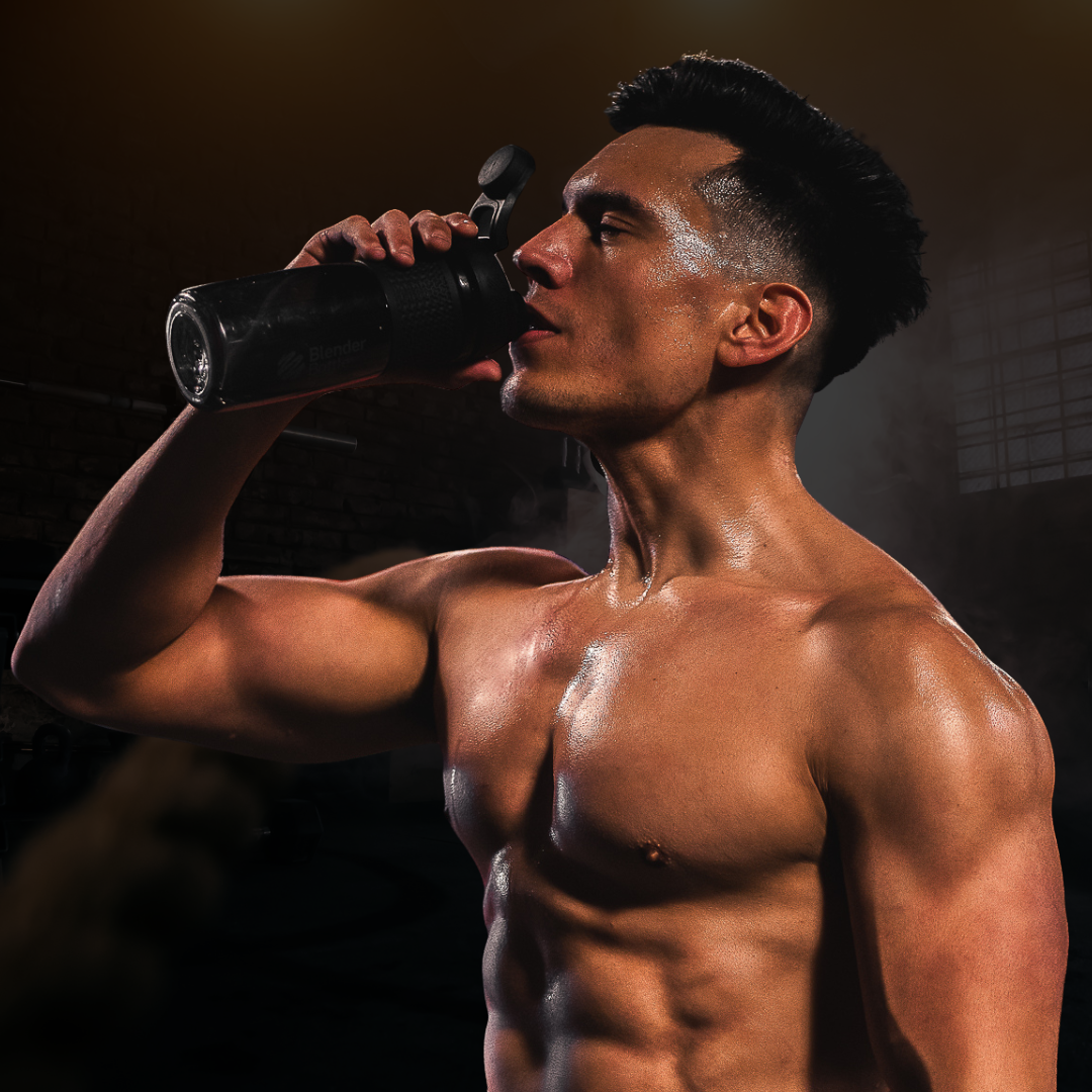 West Covina personal trainer with shredded physique drinking water after workout